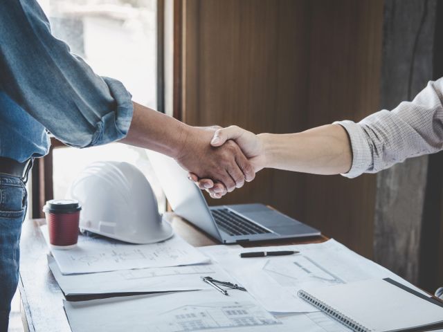 image of handshake agreement to joint ventures in construction